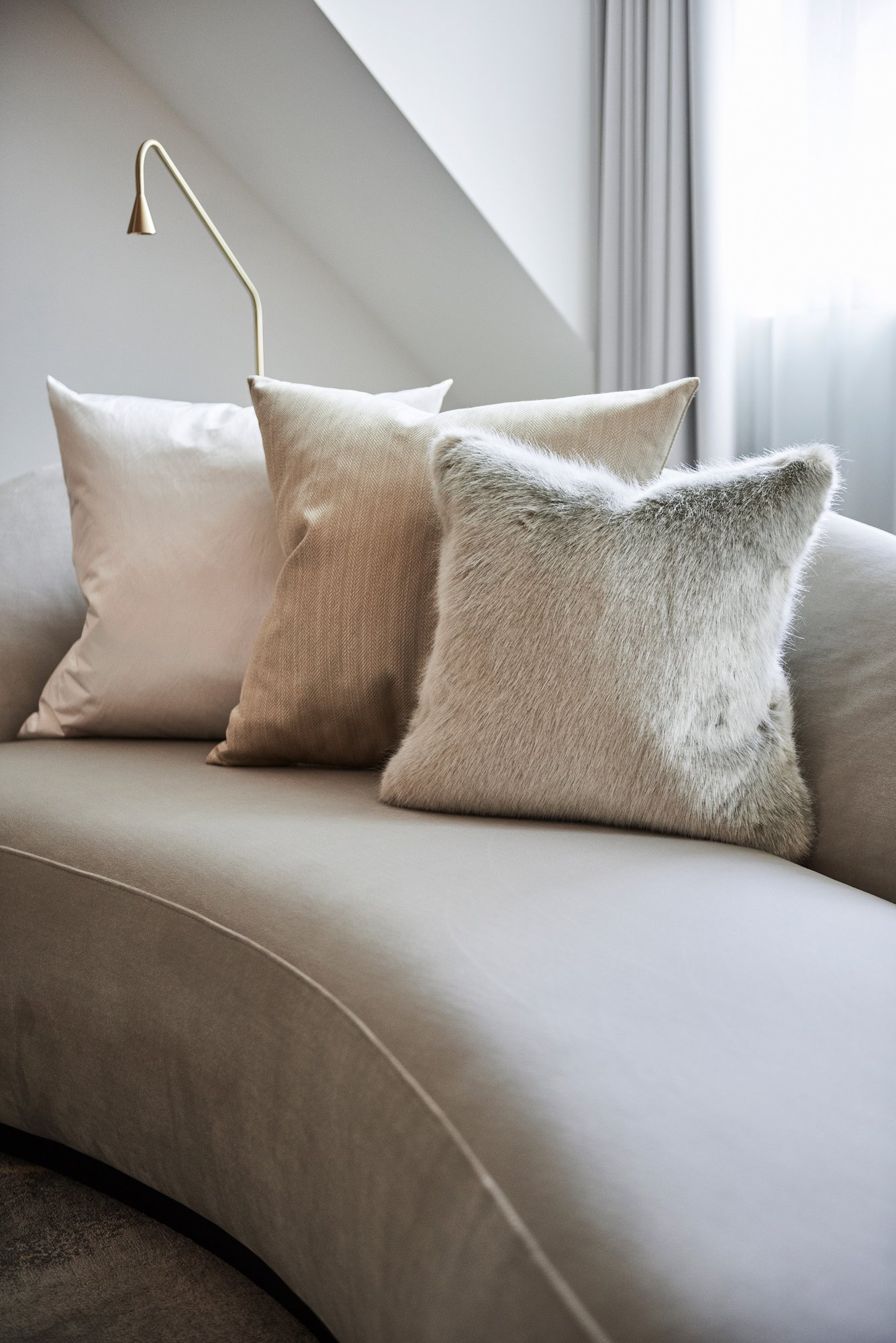 beige pillows fur on couch