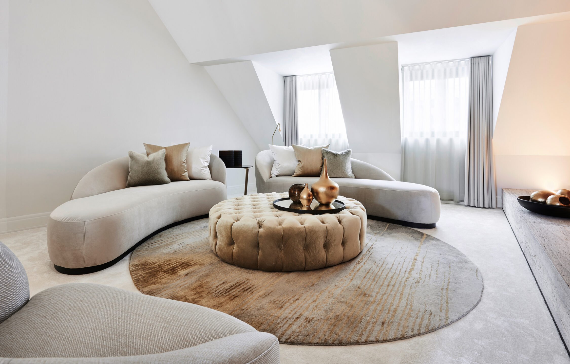 interior design beige couch gold details circle carpet